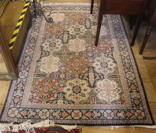 Persian multi-coloured rug with all-over floral and foliate medallion design